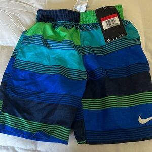 Brand new Nike bathing suit, size 6-7 years old, still with tags attached.